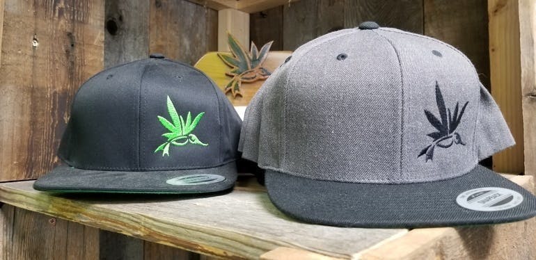marijuana-dispensaries-altitude-organic-medicine-nevada-in-colorado-springs-aom-logo-hat